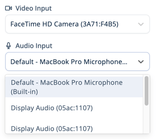 Settings panel showing dropdown menus for selecting video and audio input. The video input is set to FaceTime HD Camera, and the audio input dropdown is expanded with options including the built-in MacBook Pro Microphone and Display Audio devices.